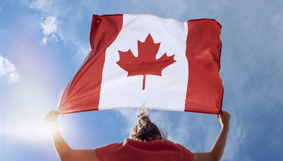Girl-Holding-Canada-Flag.webp